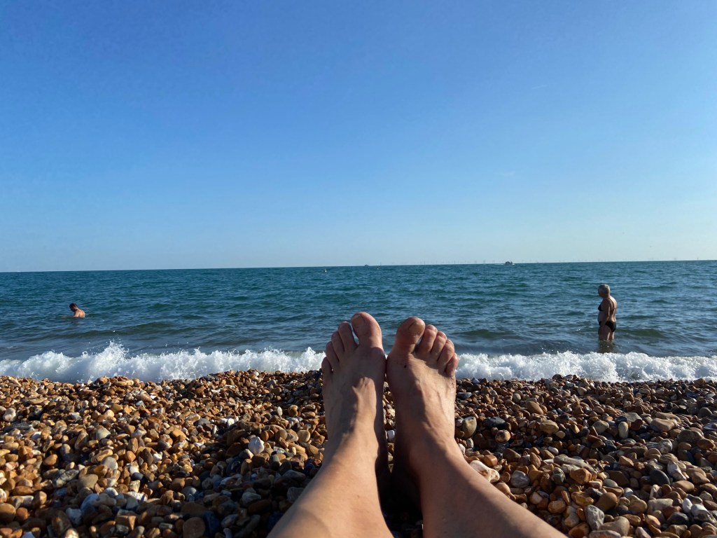 Heather's feet on Brighton Beach